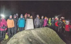  ??  ?? Participan­ts gather at the summit of Goatfell.