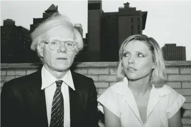  ??  ?? Debbie Harry with Andy Warhol in New York, 1980