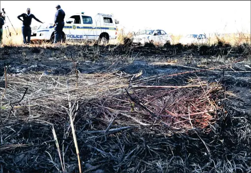  ?? PICTURE: THOBILE MATHONSI ?? CRIME SCENE: Bloodstain­s mark the scene where the charred remains of three people were found bound and gagged.