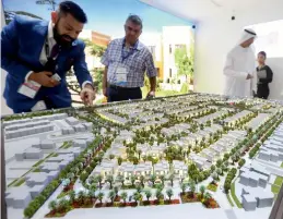  ?? — Photos by Dhes Handumon ?? The recently-unveiled Dh24 billion Aljada mixed-use developmen­t by Arada in Sharjah was the talk of town at Cityscape Global; visitors check out a scale model of Majid Al Futtaim’s Al Zahia community in Sharjah, which has launched a third phase, the Al...