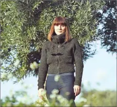  ?? JOSE JORDAN/AFP ?? Sira Plana, co-founder of ‘Adopt an Olive Tree’, poses next to one in Oliete, northeaste­rn Spain, in December last year.