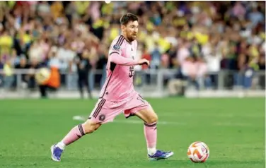  ?? Agence France-presse ?? ↑
Lionel Messi of Inter Miami runs with the ball during their CONCACAF Champions Cup match against Nashville.