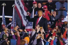  ?? GENE J. PUSKAR — THE ASSOCIATED PRESS ?? Supporters cheer as President Donald Trump departs a campaign rally at John P. Murtha Johnstown-Cambria County Airport in Johnstown, Pa., Tuesday.