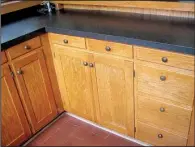  ?? Photos courtesy of Kitchen Tune-Up ?? Before and after: Sometimes cabinets only need a good cleaning and tune-up to restore the beauty of the wood.