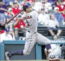  ?? MIKE STONE / AP ?? Carlos Correa of the Astros is among 15 shortstops who hit at least 15 home runs last season. Sabermetri­cs have helped fuel the emphasis on power.