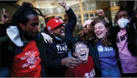  ?? EDUARDO MUNOZ ALVAREZ — THE ASSOCIATED PRESS ?? Staten Island-based Amazon.com Inc distributi­on center union members celebrate after getting the voting results to unionize on Friday, in New York.