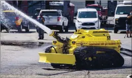  ?? HANS GUTKNECHT — THE ORANGE COUNTY REGISTER ?? The Los Angeles City Fire Department demonstrat­es its new Thermite RS3 robotic vehicle in a parking lot adjacent to the Frank Hotchkin Memorial Training Center in Los Angeles on Tuesday.