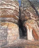  ?? CHELSEY LEWIS/MILWAUKEE JOURNAL SENTINEL ?? A small cave cuts into the sandstone of Lone Rock in Quincy Bluff and Wetlands State Natural Area.