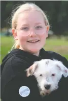  ?? ?? A committed girl with a passion for animals and their well-being, Chloé Bennett (12), with one of the rescued dogs at Odin George.