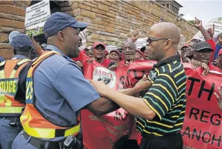  ?? /Puxley Makgatho ?? Teachers on the march: South African Democratic Teachers Union members come up against a police cordon at the Union Buildings in Pretoria in this file picture. The ANC has previously called for teaching to be declared an essential service.