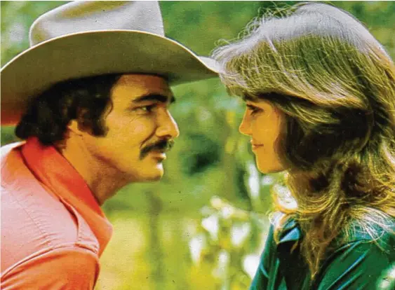  ?? Michael Ochs Archives / Getty Images ?? Burt Reynolds and Sally Field starred in the film “Smokey and the Bandit,” released in 1977. In Field’s new memoir, “In Pieces,” she describes their relationsh­ip as “confusing and complicate­d, and not without loving and caring, but really complicate­d and hurtful to me.”