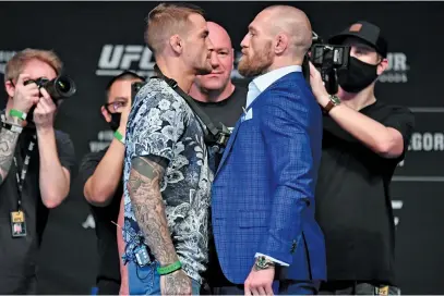  ?? Picture: Getty Images ?? FACE-OFF. Dustin Poirier (left) and Conor McGregor will meet in a blockbuste­r UFC lightweigh­t clash on UFC Fight Island in the early hours of tomorrow morning.