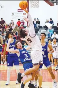  ?? Westside Eagle Observer/RANDY MOLL ?? Gentry’s Jonathon Corter goes up for a shot from under the basket during Friday night’s game against the visiting Paris Eagles.