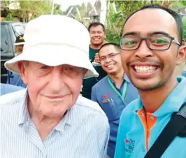  ??  ?? Adi takes a selfie with East-West Seed founder and honorary chairman Simon Groot on a visit to a seed production area in Indonesia.