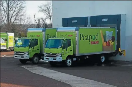  ?? DIGITAL FIRST MEDIA FILE PHOTO ?? Peapod by Giant has expanded its online grocery shopping and delivery in Berks County — making the service available in Exeter and Birdsboro. In this file photo Peapod trucks are ready to be loaded at the North Coventry Giant Food store on Glocker Way....