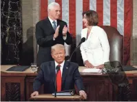  ?? AP ?? President Donald Trump arrives to deliver his State of the Union address to a joint session of Congress on Capitol Hill in Washington on Tuesday. Behind him, House Speaker Nancy Pelosi smiles at Vice President Mike Pence.