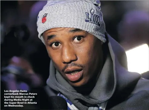  ?? — THE ASSOCIATED PRESS ?? Los Angeles Rams cornerback Marcus Peters kept his mouth in check during Media Night at the Super Bowl in Atlanta on Wednesday.