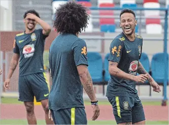  ?? EKATERINA LYZLOVA THE ASSOCIATED PRESS ?? Superstar forward Neymar, right, of Brazil reacts during a training session in Sochi, Russia, on Wednesday. Brazil will face Belgium in soccer’s World Cup quarter-finals Friday.