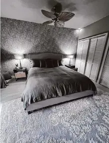  ?? Richard A. Marini/staff ?? The abstract palm frond wallpaper and ceiling fan in the main bedroom tie in with the trees outside.