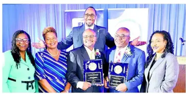  ?? ?? GOJ AWARDS TOP CIVIL SERVANTS OF THE YEAR: Hon. Marsha Smith (right) MP, State Minister in the Ministry of Finance and the Public Service, poses with Leodis Douglas (left), Chairman, Board of Directors, FHC, Roxann Linton (2nd left), Chief Executive Officer, FHC, Oniel Grant (second row), President, Jamaica Civil Service Associatio­n (JSCA), Lennox Wallace (2nd right), Chief Public Health Inspector (Actg. Parish Manager) and winner of the Managerial category and Oliver Morris (centre), Customer Service Officer and winner of the Mid Managerial category at Terra Nova All-suite Hotel on Friday, November 18, 2022. Missing is Simone Turton, Health Records Technician and winner in the Technical category.