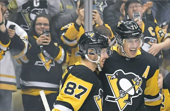  ?? Pittsburgh Post-Gazette ?? Evgeni Malkin, right, scored two goals and Sidney Crosby provided three assists in the Penguins’ 6-3 win Thursday at PPG Paints Arena.