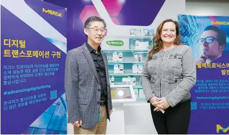  ?? Courtesy of Merck Korea ?? Katherine Dei Cas, right, executive vice president and head of the delivery systems & services and specialty gases businesses of Merck, poses with WooKyu Kim, managing director of Merck Korea, during their visit to the company’s office in Ansan, Gyeonggi Province, Oct. 26, 2023.