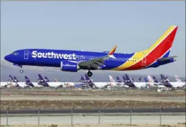  ?? Matt Hartman/Associated Press ?? A Southwest Airlines Boeing 737 Max aircraft lands at the Southern California Logistics Airport in the high desert town of Victorvill­e, Calif., in March 2019.