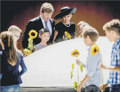  ?? PICTURE: AP. ?? JET TRAGEDY: Dutch King Willem-Alexander, centre left, and Queen Maxima at the national monument for the MH17 victims.