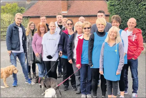  ??  ?? Esbs’ staff members, their families, friends and even pets have undertaken a sponsored walk for a charity supporting people with Angelman Syndrome.