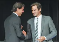  ?? D DIPASUPIL / GETTY IMAGES / AFP ?? Rafael Nadal (left) and Roger Federer attend the ATP Heritage Celebratio­n at The Waldorf-Astoria on Friday in New York City.