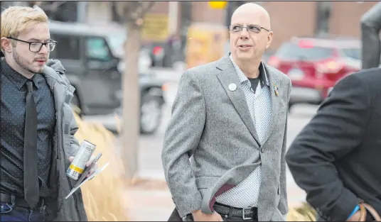  ?? David Zalubowski The Associated Press ?? Michael Anderson, left, a Club Q shooting survivor, walks Wednesday with the club’s co-owner, Matthew Haynes, into the El Paso County courthouse for a preliminar­y hearing for Anderson Lee Aldrich, the suspect in the mass shooting on Nov. 19.