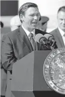  ?? LYNNE SLADKY/AP ?? During Tuesday’s inaugural address, new Florida Gov. Ron DeSantis sounded like Winston Churchill when speaking about the environmen­t. But he undercut his talk of ending tribalism in this deeply divided state by throwing red meat to his partisan supporters.