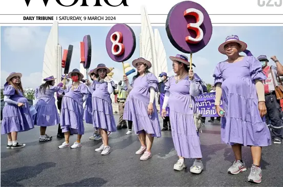  ?? LILLIAN SUWANRUMPH­A/AGENCE FRANCE-PRESSE ?? THAI labor union members and women’s rights activists take part in a march for better maternity rights on Internatio­nal Women’s Day in Bangkok, Thailand on 8 March 2024.