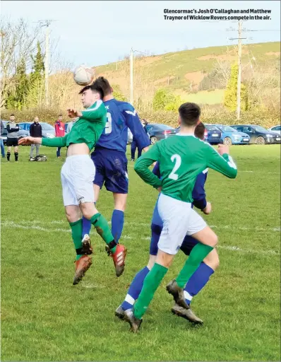  ??  ?? Glencormac’s Josh O’Callaghan and Matthew Traynor ofWicklow Rovers compete in the air.