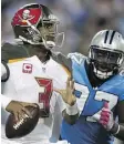  ?? STREETER LECKA/ GETTY IMAGES ?? Mario Addison, right, of the Carolina Panthers pursues quarterbac­k Jameis Winston of the Tampa Bay Buccaneers in the second half during their game Monday in Charlotte, N.C. Winston led a 66-yard drive to get the Buccaneers into field goal range.