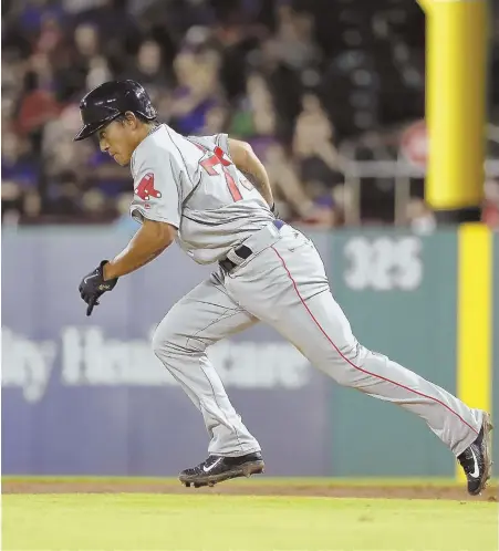  ?? AP PHOTO ?? UP TO SPEED QUICKLY: Tzu-Wei Lin dashes to second base during last night’s game against the Rangers in Arlington, Texas. Lin has been a big addition to the Red Sox lineup while filling the void at third base.