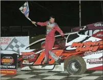  ?? RICH KEPNER - FOR MEDIANEWS GROUP ?? Brett Kressley leaps from his car after winning the modified feature at Grandview on April 10.