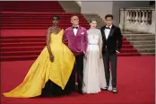  ?? MATT DUNHAM — THE ASSOCIATED PRESS ?? Lashana Lynch, from left, Daniel Craig, Lea Seydoux and Cary Joji Fukunaga pose for photograph­ers upon arrival for the World premiere of the new film from the James Bond franchise ‘No Time To Die’, in London Tuesday.