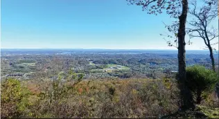  ??  ?? IN THE PICTURESQU­E SETTING ATOP THE BROW OF SIGNAL MOUNTAIN, THIS HOME BOASTS CHARACTER AND BEAUTY BOTH INSIDE AND OUT.