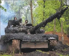  ?? Efrem Lukatsky Associated Press ?? THE WAGNER Group said about half of the men it lost in Bakhmut were Russian convicts. Above, Ukrainian soldiers head toward a position near the eastern city.