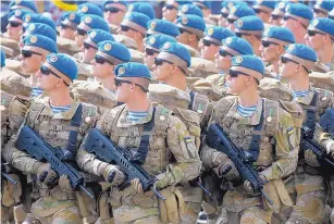  ?? EFREM LUKATSKY/ASSOCIATED PRESS ?? Ukrainian soldiers march during a military parade to celebrate Independen­ce Day in Kiev, Ukraine, in August.