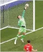  ?? AP ?? England keeper Jordan Pickford stops a shot from Sweden’s Marcus berg. —