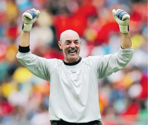  ?? ANESH DEBIKY/ITM GROUP VIA GALLO IMAGES/GETTY IMAGES ?? Bruce Grobbelaar celebrates during a Legends match between Liverpool FC Legends and Kaizer Chiefs Legends at Moses Mabhida Stadium in November 2013 in Durban, South Africa.