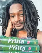  ?? BY KEITH MILLER PROVIDED ?? Novelist and Savannah native Keith F. Miller poses with copies of his debut book “Pritty.” He wrote the novel over a period of roughly 14 years before Harper Collins secured it for publicatio­n. Miller is currently finalizing edits on the sequel.