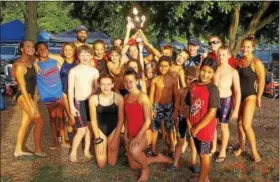  ?? BARRY TAGLIEBER — FOR DIGITAL FIRST MEDIA ?? The Baker Park swimming team poses with the championsh­ip trophy after winning the Tri-County Swim League A Championsh­ips team title on July 26in Phoenixvil­le.