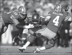  ?? MONICA HERNDON/TRIBUNE NEWS SERVICE ?? Tampa Bay Buccaneers defensive end Carl Nassib (94) tackles San Francisco 49ers quarterbac­k Nick Mullens (4) during the game on Sunday in Tampa, Fla.