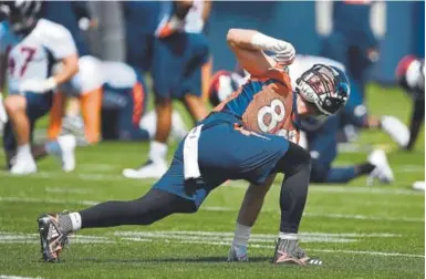  ?? Joe Amon, The Denver Post ?? Broncos tight end Jake Butt works out during OTAs in May. Despite not having played a down in the NFL, he ranks as the favorite to start the opener Sept. 9 against the Seattle Seahawks.