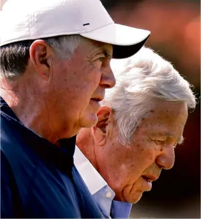  ?? JOHN TLUMACKI/GLOBE STAFF ?? Patriots coach Bill Belichick (left) and owner Robert Kraft chatted during practice Thursday, before Kraft and his family celebrated the $250 million renovation of Gillette Stadium.