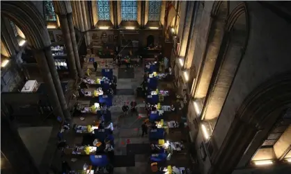  ?? Photograph: Neil Hall/EPA ?? People being vaccinated against Covid in Salisbury Cathedral on 20 January.