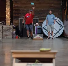  ?? Staff photo by Kelsi Brinkmeyer ?? ■ Cornhole players
from across the Texarkana region meet
on Tuesday nights at Crossties for a weekly tournament hosted by
Ark-La-Tex Baggers. players have ranged in age from 12 to around 70, with women and girls as well as men participat­ing. Other tournament­s can be found with the use of a phone app or
Facebook.